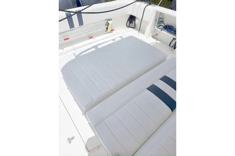Slide: The Image of 2008 Intrepid 430 Sport Yacht interior with white cushioned seating. - 62