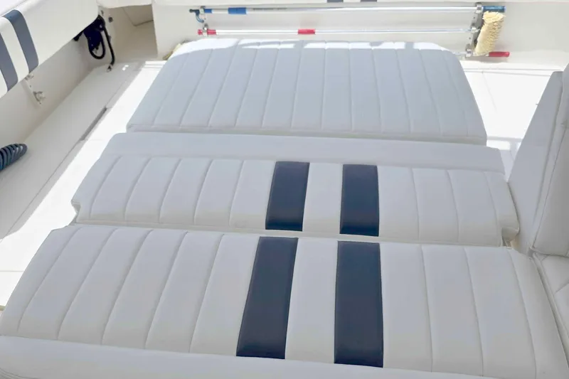 Slide: The Image of White cushioned seating on 2008 Intrepid 430 Sport Yacht, featuring sleek design and comfort. - 63