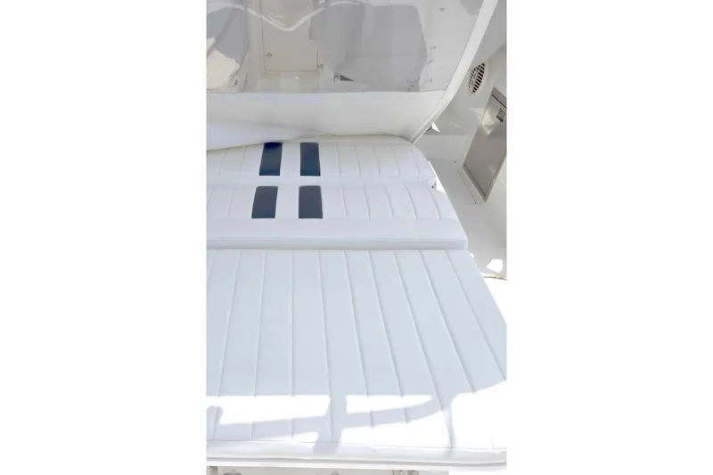 Slide: The Image of White cushioned seating on a 2008 Intrepid 430 Sport Yacht, showcasing sleek design. - 64