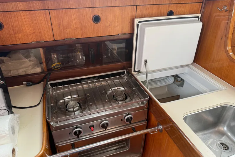 Slide: The Image of Galley kitchen in 1985 Beneteau First 375 sailboat with stove and sink. - 23