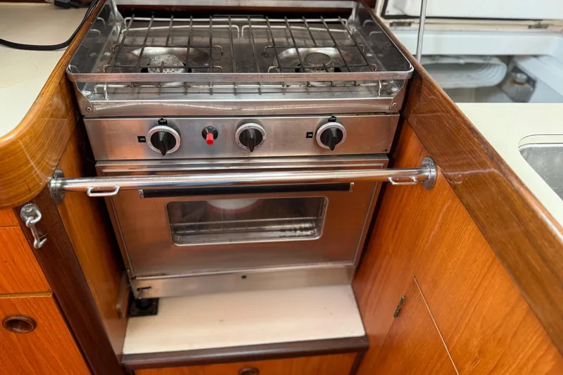 Slide: The Image of Galley kitchen in 1985 Beneteau First 375 sailboat with stove and oven. - 25