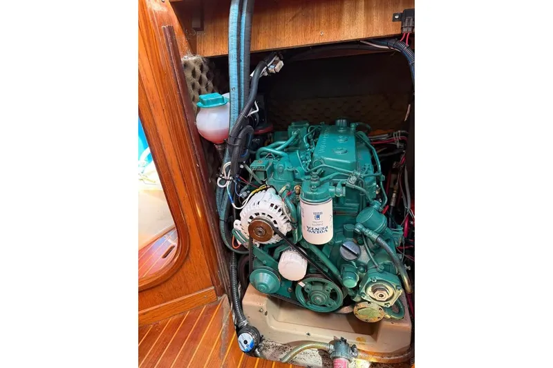 Slide: The Image of Engine compartment of a 1985 Beneteau First 375 sailboat, featuring a Volvo Penta engine. - 9