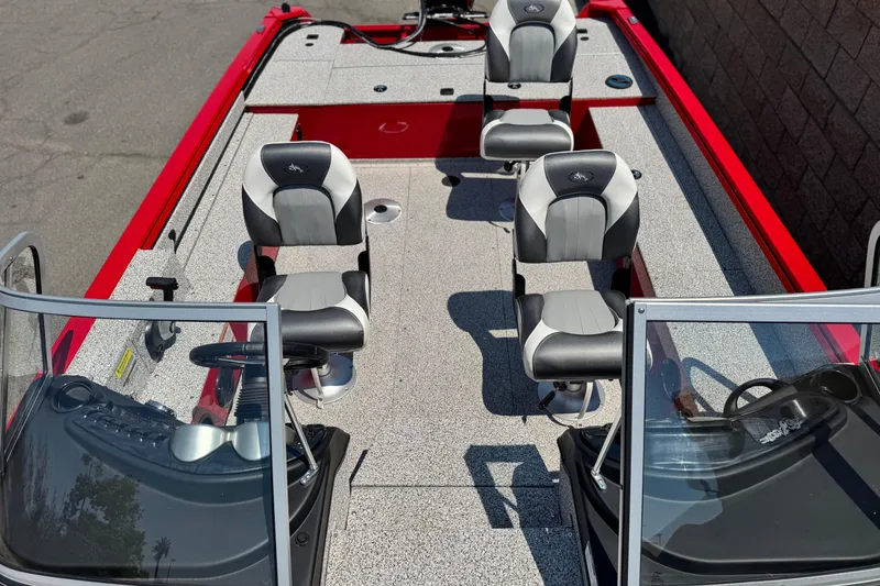 Slide: The Image of Red Apex Outlander V2010 boat, 2024 model, with four seats and dual windshields. - 11