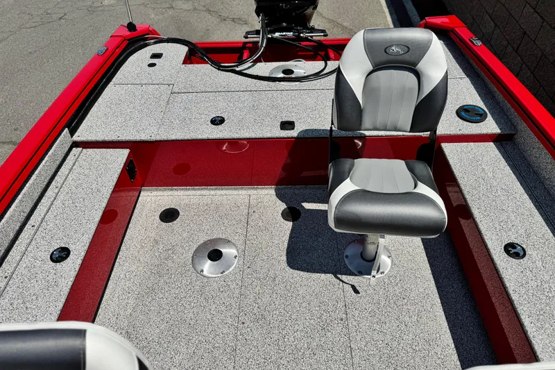 Slide: The Image of 2024 Apex Outlander V2010 boat interior with gray seating and red accents. - 13