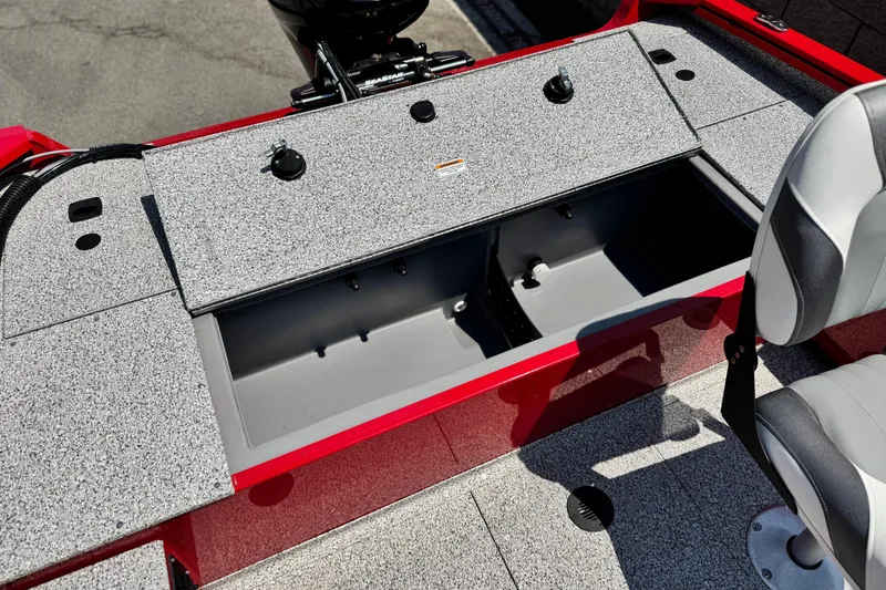 Slide: The Image of 2024 Apex Outlander V2010 boat interior with open storage compartment and seating. - 15