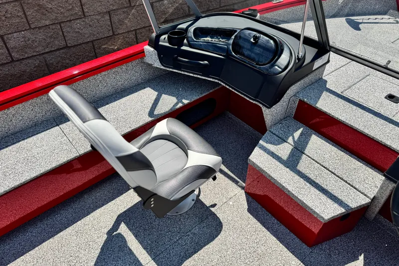 Slide: The Image of 2024 Apex Outlander V2010 boat interior with gray seat and red accents. - 16