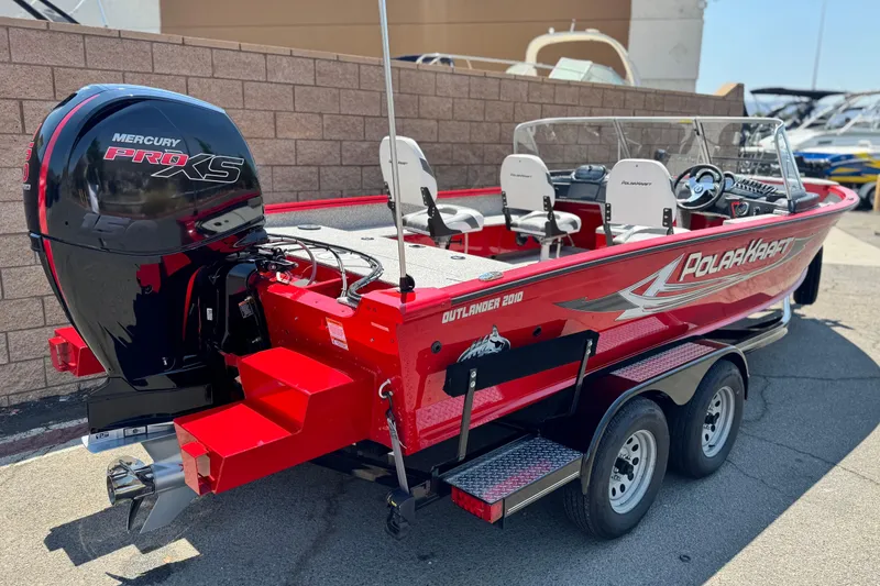Slide: The Image of Red Apex Outlander V2010 boat, 2024 model, with Mercury Pro XS engine, on a trailer. - 5