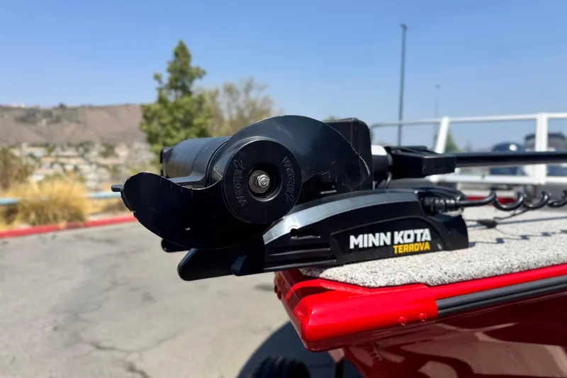 Slide: The Image of Minn Kota Terrova motor on Apex Outlander V2010, 2024 model, in outdoor setting. - 7