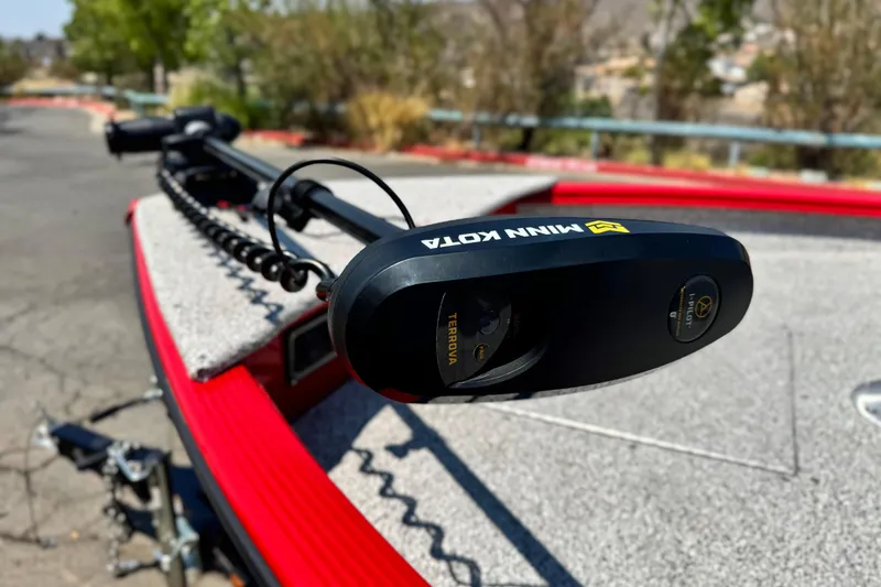 Slide: The Image of Minn Kota Terrova trolling motor on Apex Outlander V2010, 2024 model, in outdoor setting. - 8