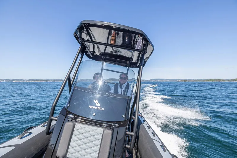 Slide: The Image of Manufacturer Provided Image: 2025 Highfield Sport 660 boat cruising on open water, clear blue sky. - 4
