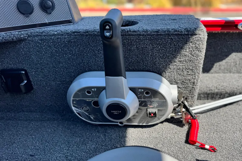 Slide: The Image of 2024 Lund 1650 Rebel XL Sport boat throttle control, featuring a sleek design and safety lanyard. - 20