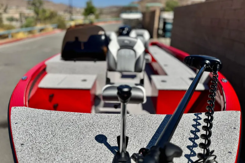 Slide: The Image of 2023 Apex Polar Kraft V186 boat with red exterior and gray interior, parked outdoors. - 11