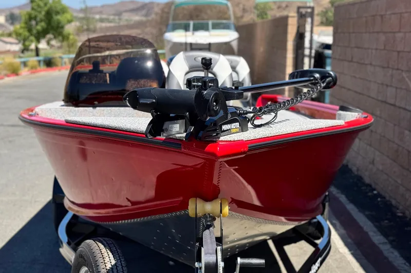 Slide: The Image of 2023 Apex Polar Kraft V186 boat with Minn Kota trolling motor, parked outdoors. - 3