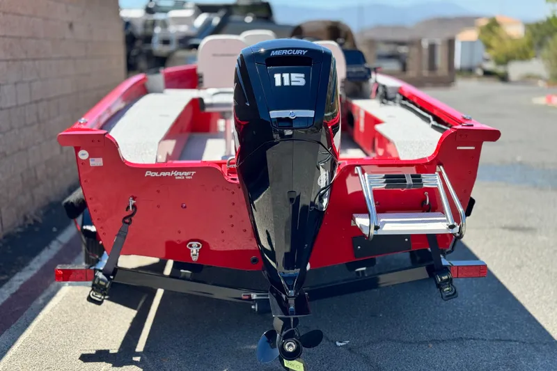 Slide: The Image of 2023 Apex Polar Kraft V186 boat with Mercury 115 engine, red exterior, parked outdoors. - 5