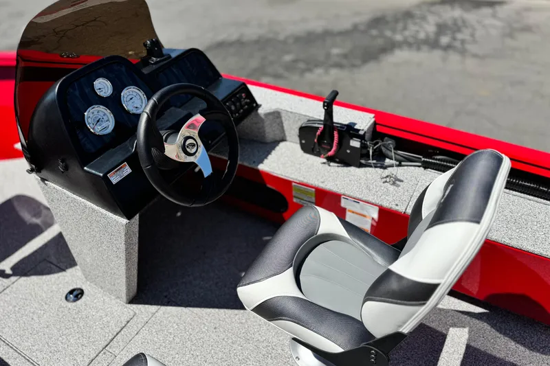 Slide: The Image of 2023 Apex Polar Kraft V186 boat interior with steering wheel and gauges. - 23