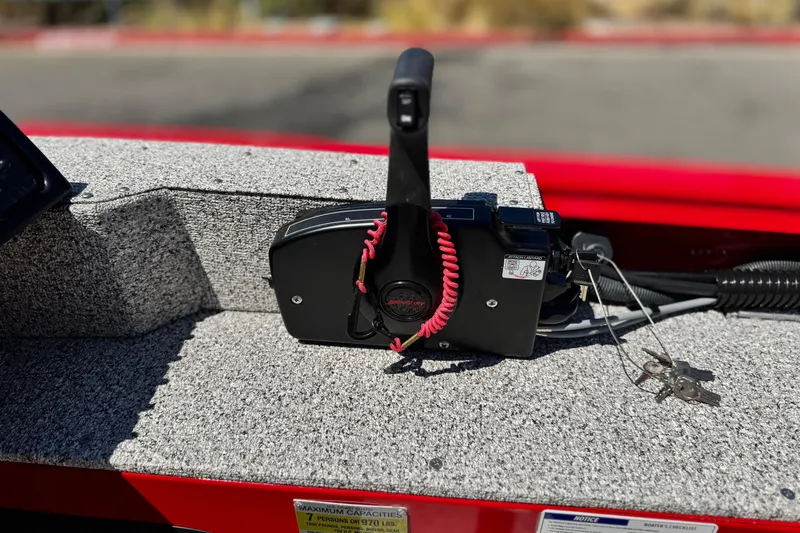 Slide: The Image of Control panel of 2023 Apex Polar Kraft V186 boat with keys and safety cord. - 25