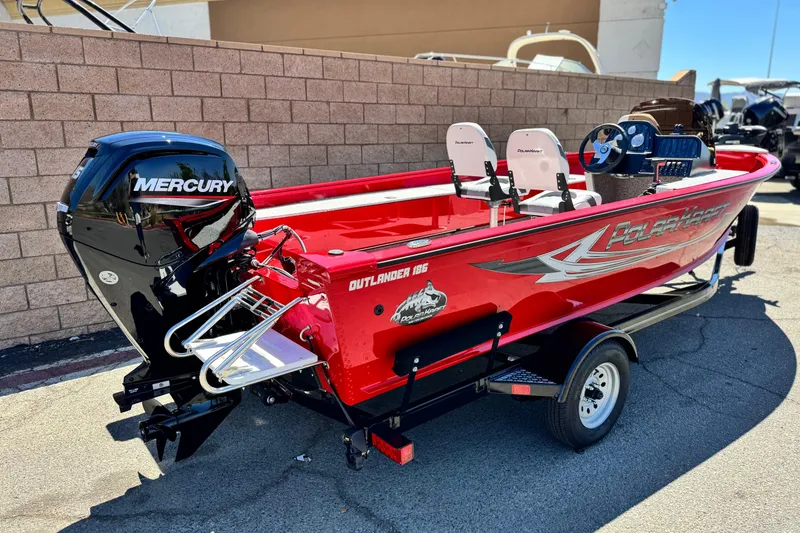 Slide: The Image of 2023 Apex Polar Kraft V186 boat with Mercury engine, red exterior, parked on trailer. - 6