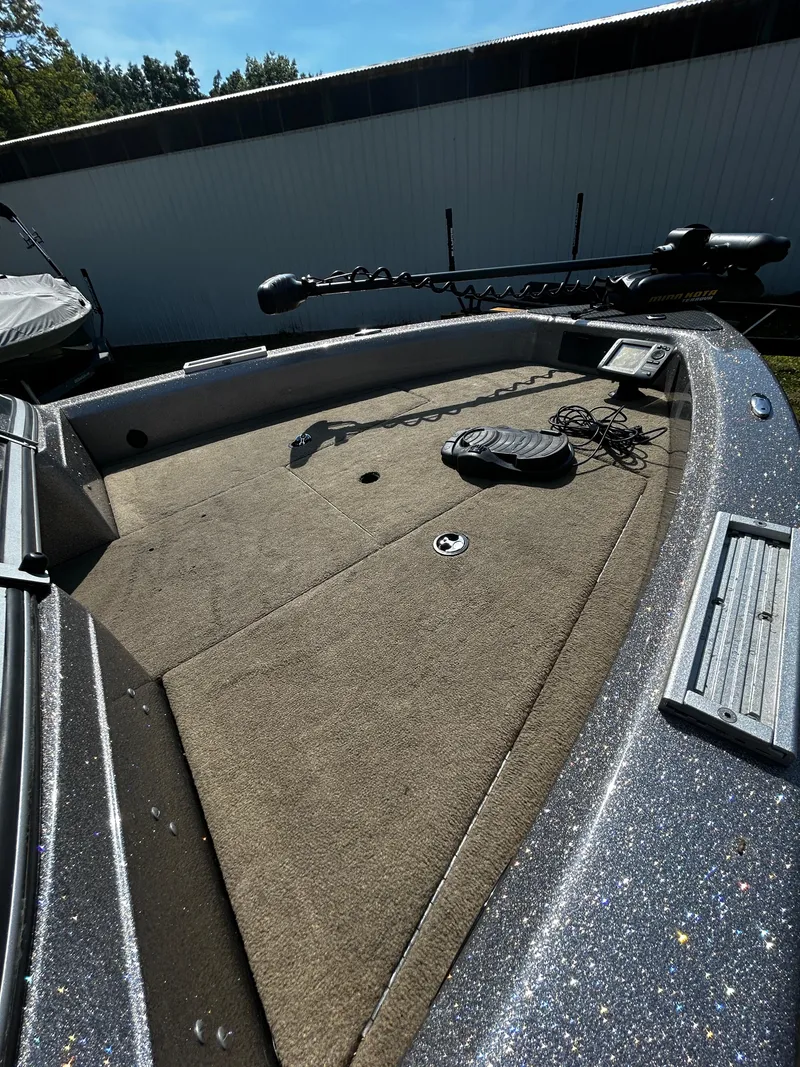 Slide: The Image of 2013 Triton 186 Fishunter boat deck with trolling motor and foot pedal. - 5