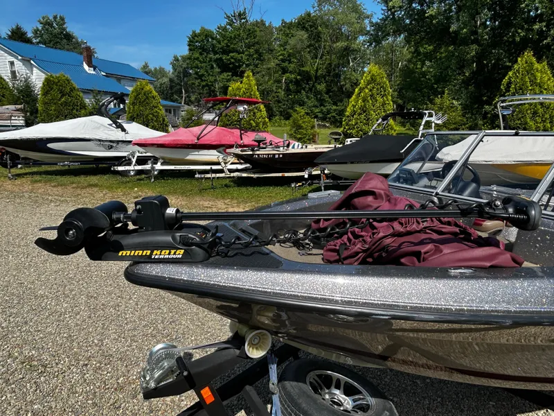 Slide: The Image of 2013 Triton 186 Fishunter boat with Minn Kota motor in a boatyard. - 8