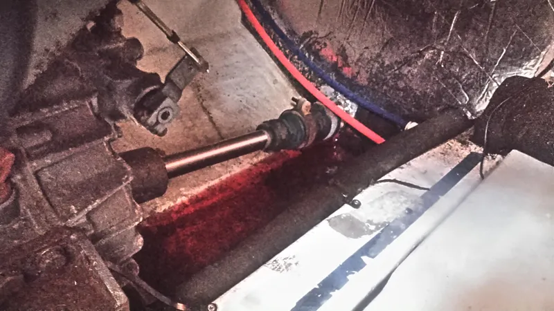 Slide: The Image of Engine compartment of a 1998 Bruckmann BLUESTAR 29 boat, showing mechanical components. - 32