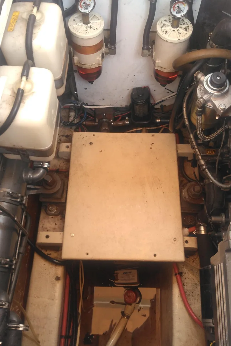 Slide: The Image of Engine compartment of a 1998 Bruckmann BLUESTAR 29 boat, showing mechanical components and wiring. - 35