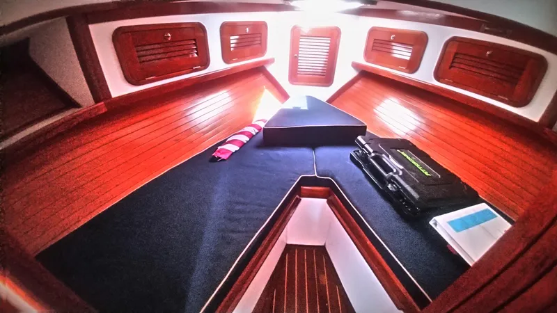 Slide: The Image of Interior cabin of 1998 Bruckmann BLUESTAR 29 with wooden paneling and cozy bedding. - 8