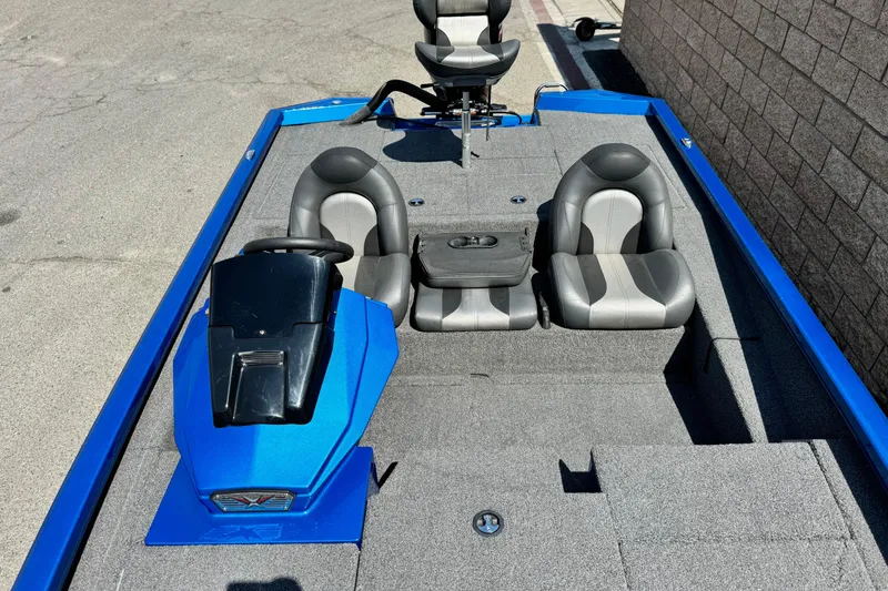 Slide: The Image of 2021 Vexus AVX1980 boat interior with gray seats and blue accents. - 13