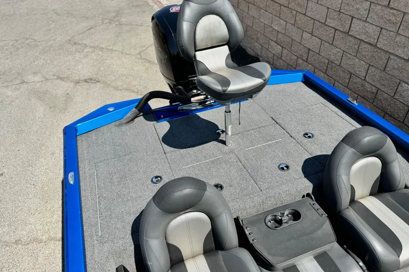 Slide: The Image of 2021 Vexus AVX1980 boat interior with gray seating and blue trim. - 14