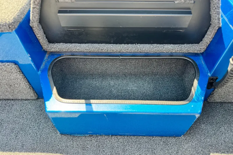 Slide: The Image of 2021 Vexus AVX1980 boat storage compartment with blue and gray interior. - 16