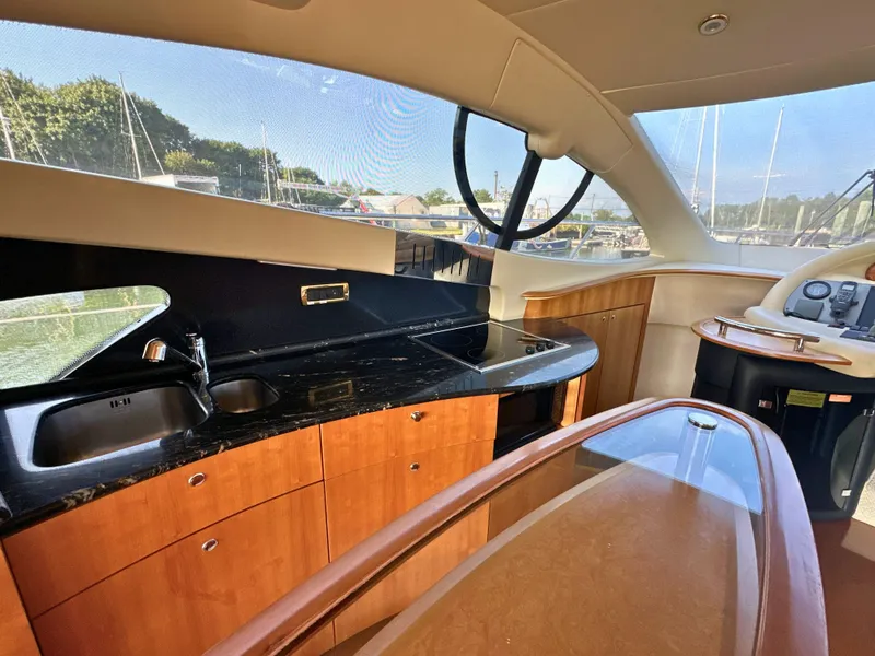 Slide: The Image of Luxurious interior of 2010 Azimut 55E yacht with modern kitchen and sleek design. - 22