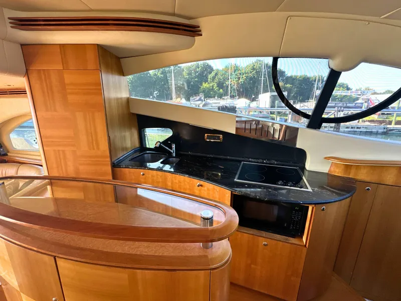 Slide: The Image of Luxurious interior of a 2010 Azimut 55E yacht with modern kitchen amenities. - 23