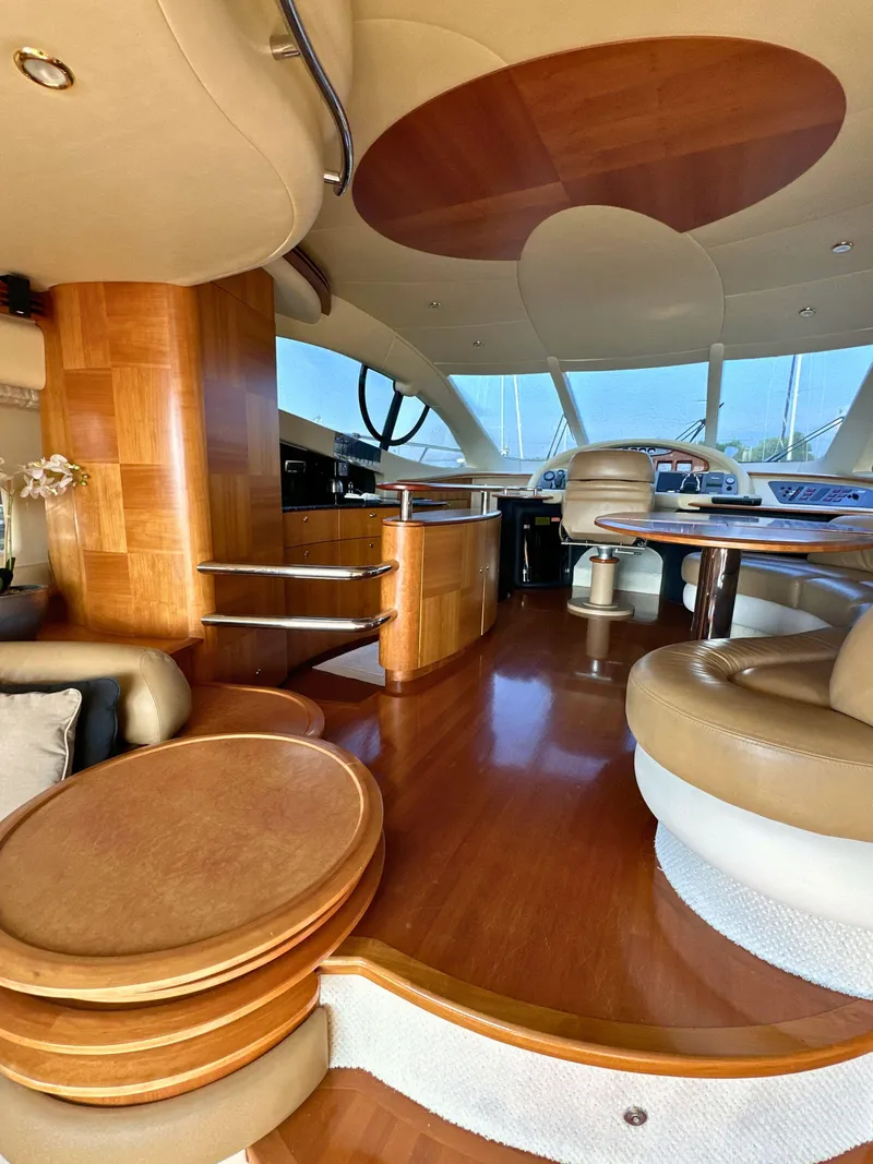 Slide: The Image of Luxurious interior of a 2010 Azimut 55E yacht with elegant wood finishes and modern design. - 34