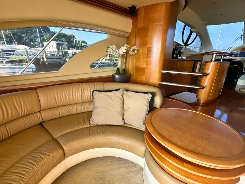 Slide: The Image of Luxurious interior of 2010 Azimut 55E yacht with leather seating and wooden accents. - 36