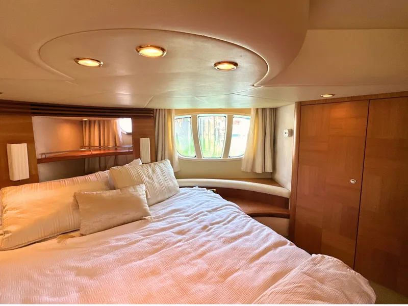 Slide: The Image of Luxurious bedroom interior of 2010 Azimut 55E yacht with elegant wood finishes. - 41
