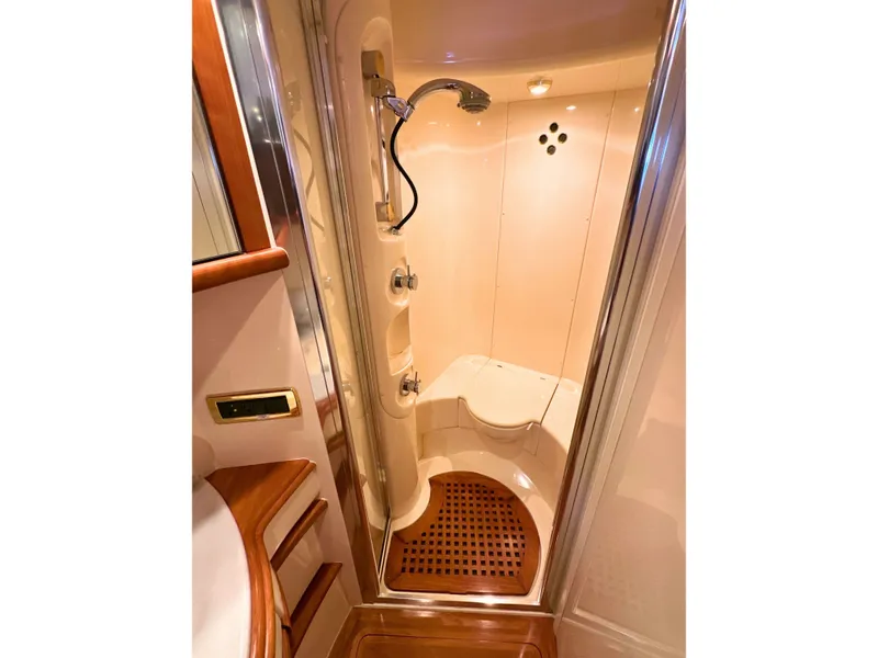 Slide: The Image of Luxurious shower area in 2010 Azimut 55E yacht with elegant wood accents. - 48