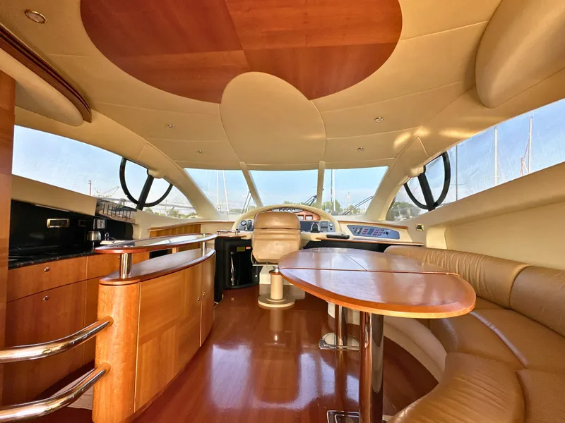 Slide: The Image of Luxurious interior of a 2010 Azimut 55E yacht with elegant wood finishes. - 9