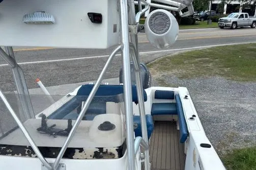 Slide: The Image of 2006 Sea Hunt 232 CC boat with blue seating and fishing equipment. - 4