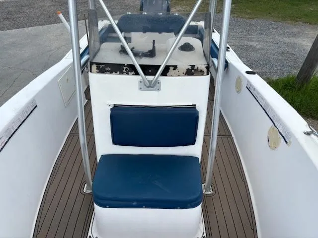 Slide: The Image of 2006 Sea Hunt 232 CC boat interior with blue seating and console. - 6