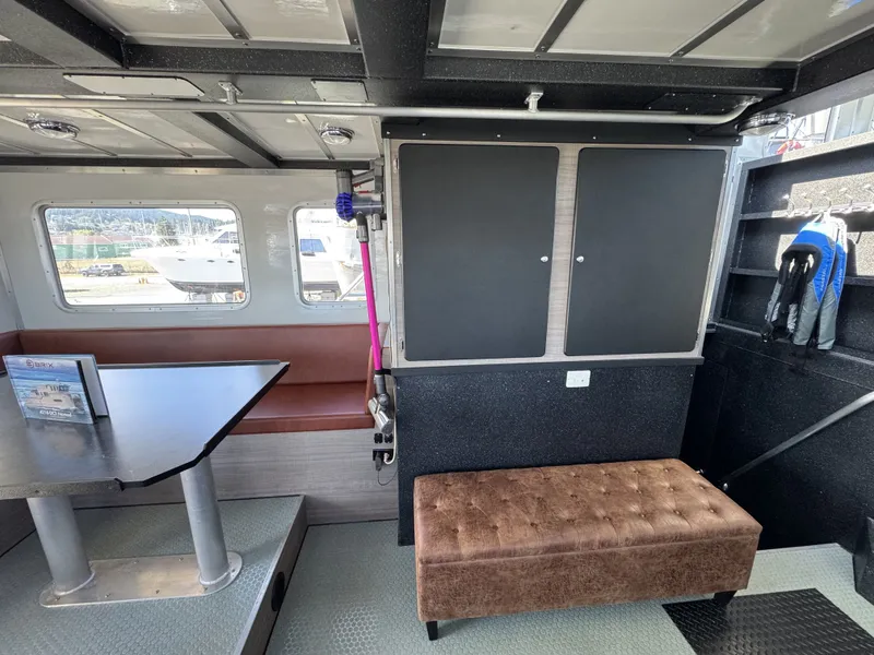 Slide: The Image of Interior of 2020 Aluminum Cruiser 42' Trawler with seating and storage. - 11