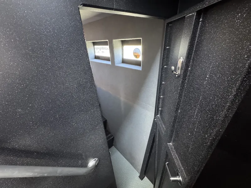 Slide: The Image of Interior of 2020 Aluminum Cruiser 42' Trawler with sleek, modern design and small windows. - 25