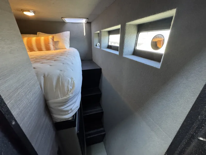 Slide: The Image of Cozy bedroom in 2020 Aluminum Cruiser 42' Trawler with modern design and natural light. - 26