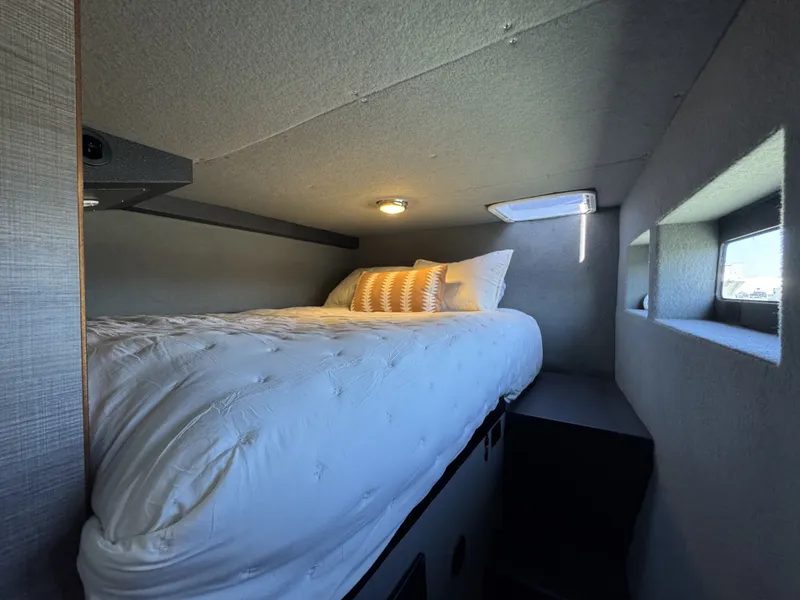 Slide: The Image of Cozy bedroom in 2020 Aluminum Cruiser 42' Trawler, featuring a comfortable bed and modern design. - 27