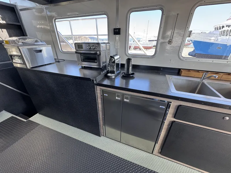 Slide: The Image of Modern kitchen in 2020 Aluminum Cruiser 42' Trawler with appliances and dual sinks. - 8