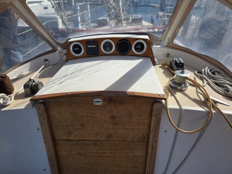 Slide: The Image of 1982 Bristol 35.5 sailboat cockpit with navigation instruments and ropes. - 10