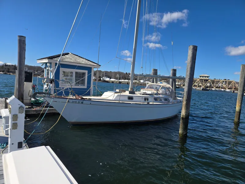 Slide: The Image of 1982 Bristol 35.5 sailboat docked at marina with blue sky background. - 3