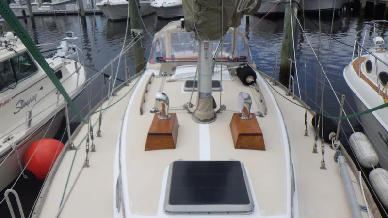 Slide: The Image of 1982 Bristol 35.5 sailboat docked at marina, showcasing deck and rigging. - 5
