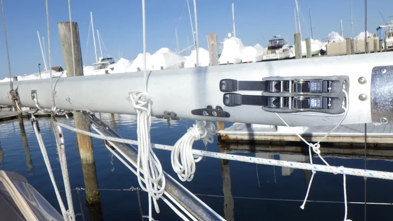 Slide: The Image of Close-up of a 1982 Bristol 35.5 sailboat mast with rigging in a marina. - 8