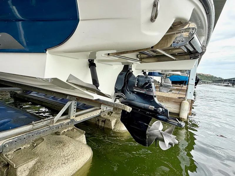 Slide: The Image of 2013 Sea Ray 250 SLX boat with MerCruiser engine, docked on a lift. - 17