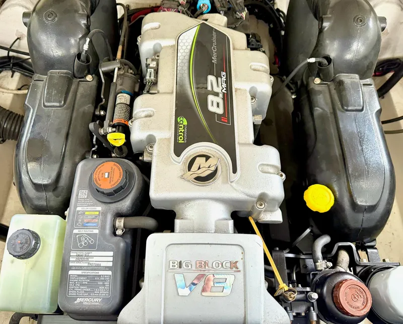 Slide: The Image of Engine of a 2013 Sea Ray 250 SLX boat, featuring a MerCruiser 8.2 MAG. - 21