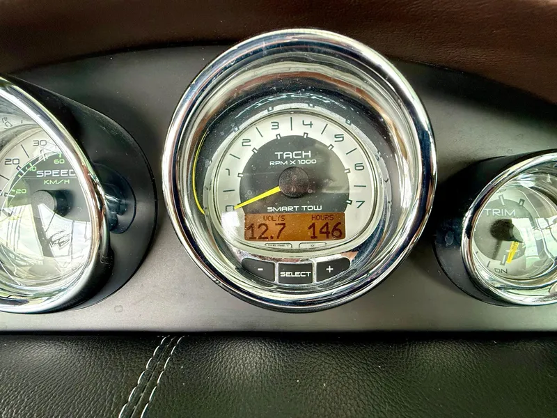 Slide: The Image of Dashboard of 2013 Sea Ray 250 SLX boat showing tachometer and gauges. - 22